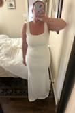 I ordered this dress for my elopement and I am OBSESSED with it. I am on the shorter side (5'4) and curvier (typically a size 12 in jeans) and this dress hugs everything perfectly (I ordered an XL). With that being said, I did have to have a couple of alterations done to it (shorted length & tighten the shoulders) but outside of that, I could've worn this as it was when I bought it. It's a bright white so I wore some shape wear underneath to help smooth any bumps but overall, the material is excellent quality & very comfortable. Easy to move in and a lot of room to add accessories despite the bow being the main attraction on the back. - Alli C.
