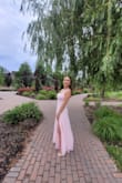 Lots of room for a larger bust and I could even wear a bra with it. The slit really added some flare to the dress. - Tristan V.