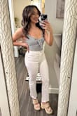 I typically order a size 25 with my jeans on Lulus but decided to listen to the reviews and go down a size. They fit perfectly everywhere because they are stretchy! No need to take the waist in like I sometimes have to do with jeans. They were tight fitting at first but slightly stretched out throughout the day to fit comfortably but still body hugging. - Joanna F.
