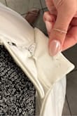 I am so disappointed by the hit-or-miss quality of Lulus clothing. I wanted to love these pants, but within the first two hours of wearing them, both the button and the clasp fell off. This is the second time I've been in public and experienced a wardrobe malfunction as a result of Lulus' poor quality of stitching. First, a strap broke on a dress while I was a guest at a wedding. Now, the clasp and buttons on a pair of trousers failed while I was out for dinner with my colleagues. How embarrassing! I expected much better from a brand like Lulus. - Katie Y.