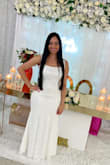 The dress is gorgeous I received a lot of compliments on my bridal shower. I am usually but went by the reviews and ordered a Medium. Was perfect on my hips but had to alter it to fit my chest area and waist. - Stephane M.