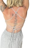I love this jumpsuit ! The back is what I am obsessed with. It does run a little long so I wore it as a regular jumpsuit as opposed to a cropped leg. Worked out perfectly! Crotch is definitely long but again, the outfit worked! - Donna