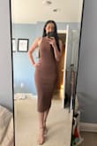 I love this dress, it fits me well, and got lots of compliments. It is tight and fitted, that is the style of the dress and I wouldn't got up a size, I was fine in a small. - Jessica M.