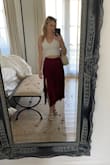 So comfortable, so flattering, so chic - a lovely skirt! The slit is higher than I expected, but its very nice and adds a bit of va va voom. There is an inner lining up top that keeps the skirt from sliding up or turning around. Fitting for brunch with the girls, date night with your person, or out around town - just depends how you style it! Love this skirt! - Amy L.