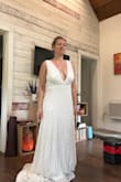 Everyone freaked out when they saw this and insisted I get married in it. I thought it was way too loose at the top. I tried it on for a July Texas wedding, and would definitely cook in it. It's a beautiful dress, and made me feel like a goddess, but I didn't like how it was at the bust. Maybe if I had the straps shortened it would have worked. I thought it was very flattering overall. Just not for me. - Tiffany E.