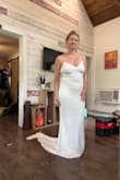 I was worried this would not look amazing in the belly area, but with some shapewear it was fine. If it didn't have a train, I think it would be too casual for a wedding dress. (We are having a simple, backyard wedding.) Out of the three I tried on, this is the one I chose. It's light weight, breathable, and does wonders for the booty. I'd say at least try it on if you're like me and a little curvier. I was hesitant but ultimately happy I chose it. - Tiffany E.
