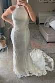 I loved this dress when I saw it online, so I ordered it. I tried not to get my hopes up about it because I didn't want to be disappointed if it didn't work out, but let me tell you& it exceeded ALL of my expectations. The train is gorgeous. It looks high end. I'm really surprised it's not part of the luxe line, but thankful to have found an incredible dress at a good price point. It fits well other than the top part needs to be taken in some, but I'm glad I didn't get a small with the risk of it being too tight. All of my measurements are accurate except my hips - I guessed there. - Kimberly S.