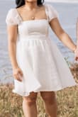 This was a very photogenic dress for our recent engagement photoshoot. Though I was overall satisfied with the fit of the dress, I did find it to be a little tight around the bust. Though not a deal breaker for me, the sleeves were a little scratchy. Would buy again! - Raisa E.