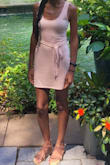 This dress hugs in all the right places and is true to size. I would order a size up if you don't like form-fitting dresses. - Gisel P.