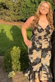 This dress runs true to size and was supportive of a larger chest (didn't need to wear a bra). It's good material for an outside summer wedding! - Mallory M.
