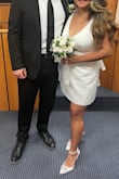 I normally do not have time to write a review for anything, but this dress has sentimental value to me. I wore it for my civil wedding and I'm so glad I did! I've never bought anything from Lulus before, but I was like, you know what, I should try. The shipping was fast! The material of the dress is good quality! It looks expensive actually!! It's like this satin dress but of thicker and good quality. The bow in the back just put the cherry on top! It's big but not overly big. The only problem was maybe on my part, but the chest area was a little tight (I have a bigger chest, so that could be it). It's not see through at all, so thank God! But if you want to order this, DO it! - Ana B.
