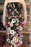 such a cute dress!! The edges of the larger flowers on the bottom aren't sewn down flat so they kind of "pop" off the dress which is a unique detail. Some of the flowers were folded during shipping and it was difficult to get the creases out so they stuck out at weird angles. There were some loose threads and imperfections with the sewing, only reasons it's 4 stars instead of 5. Fabric is sturdy, the lace up back was very flattering and I didn't even need a bra (I am large chested). Great summer wedding guest dress! - Maggie W.