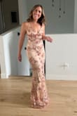The dress fit perfectly. My heels did catch the lace from time to time during the night, so a wedge shoe might be a better option. I had a lot of compliments on the dress. I used a silicone sticky bra to fill out the bust since I am smaller in the chest. It worked great. Straps are adjustable. - Katherine W.