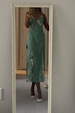 I absolutely adore this dress. The lace is so pretty; the fabric feels nice and seems durable. It fits well but is a bit loose around the waist. - Lotty A.