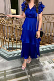 Absolutely loved this dress. It was a bit longer on me than the model (came right above my ankles) but still looked good. I did hem the neckline myself since it dipped low for me and wanted something a bit higher. The fit was great around the waist and shoulders. I got so many compliments on this dress; I felt the need to write this review. Would recommend for a formal event! The blue is even more stunning in person - Rmaah M.