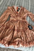 This dress is gorgeous! Fabric is good quality! It's exactly as shown in the picture. It was a little bit short but still works for me. - Carmina V.
