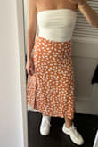 I love this skirt. I have it in white and orange, it's so flattering. I'm between a M and L and I went with a L, its a little loose in the waist but comfortable. - Leyla H.