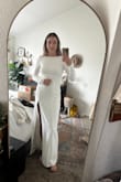 LOVE this dress! I usually am a s/m but sized down to an xs for a more snug and snatched look and it fits great - the back is slightly pulling in the picture (but also because I'm stretching to take the picture lol). The double lining helps keep things looking smooth, but you could still wear shapewear underneath. It hits just above the ground. I'm almost 5'9", but still wearing a 2.5" heel and it looks great. The slit is pretty high for me now as I have long legs / short torso, but just stitching it down a couple inches and it's great! No other alterations. I'm wearing this for my smaller, more conservative church ceremony <3 - Jenna L.