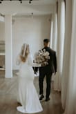 This dress was perfect for my legal wedding ceremony at City Hall! We had a destination wedding but did our legal service a month before the trip, and I wanted a dress that was simple, classic, elegant, and comfortable. I knew this was perfect as soon as I saw it online! I'm usually between sizes L and XL, so I ordered an XL to be safe. It ran a bit big, but I didn't bother exchanging it because I was going to need alterations anyway. In the end, I had the dress hemmed, shortened the arms, and had it taken in at the sides to be the perfect fit for me. The fabric is stretchy, double-lined, and a really nice texture. We got married in Toronto, Canada in April, and it was perfect for the weather without needing a jacket. If you're between sizes, I would size down because there is a good amount of stretch on this dress. Overall, I highly recommend it and am so happy I wore it on my special day! - Sydney D.