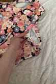 It arrived with a major tear already down the left side. Very cute top, but extremely disappointed in the arrival quality. - Heather W.
