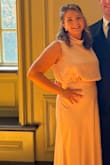 I'll be honest I was a little nervous at first. I didn't love the color - it's more peachy than pink when it actually came in and I feel like it washed me out. But with a little self tanner and hair and makeup, I felt pretty and elegant in it! The bust was a little loose, I may have been able to get away with a medium but my mom gut insecurities got the best of me ># that being said, it is a little grabby given the satin like material so it does cling a bit to less flattering areas and it did not hide sweat marks well but all in all It was a hot day and the dress was comfortable and breezy! - Katelyn G.