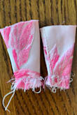 This fabric is much prettier in person! I was pleasantly surprised! The pink roses are embroidered on, and they brighten it significantly. The straps are horrible. We liked the design of them, but they had to be altered significantly. Keep in mind my daughter is already 5'8. The straps had 2.5 in. to 2.75 in. on one of the sides that had to be CUT off because the straps were uneven and defective! My daughter really likes the dress and it IS nice, but as others have said, the straps are horrible. - Stacy R.