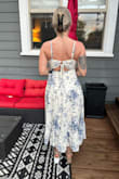I was surprised at how thick/heavy the material was, yet airy and breathable. According to Lulus size chart I'm a large, but I fit in most mediums. I got this in medium and could have gotten a small. The seam is above the tummy and the back is adjustable so there is lots of material and space/room to adjust to your size. Because of this, the side view was just not flattering on me so I returned it (this is a great dress if you're pregnant). I also didn't care too much for the neckline with the spaghetti straps. I think thicker straps would have completed it nicely. Attaching a pic of my fave view: the back. - Briana H.