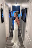 This dress was beautiful. I ordered an xs first and it fit but I was afraid it might be a little snug in the middle so I ordered the small. The cup size was too big, I had it taken in where I could but couldn't do enough because of the sequins. It was still a little too big and I had to use double-sided tape on the sides of cups. It did look gorgeous. Some sequins do fall off when you wear it. The back is absolutely stunning. - Holly D.