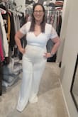 Purchased this for my upcoming bridal shower and LOVED it. It was one of the saddest moments having to send it back. When it zipped up it was beyond gorgeous on and with the right shapewear would have been phenomenal. I'm a curvier girl so jumpsuits in white are scary to try on and this one made me feel like a goddess.
However, due to the lace on the sleeves, they have no stretch or give where they connect on the underside so I was unable to lift my arms. AT ALL. Was I considering keeping it and just not lifting my arms the whole day? Yes. Was I considering spending money to see if a seamstress could fix it so I could keep it? Yes. Ultimately I decided it would cost too much and cried as I put it back in the bag. Hopefully, it will work for you, because it's beautiful. - Carly W.