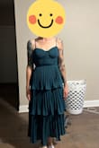 This dress came and had minimal wrinkles. It was out of stock in a S, so I ordered an XS. The XS was too tight and pinched my back. I was able to return it for a S. The S worked perfect. It was light and comfortable, but best of all required no steaming because it held no wrinkles. - Megan S.