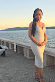 I love this dress! I wore it for a romantic date night with a great view. I'm short so the dress hit  a little lower  than expected on my legs - like below my calves. I wore it with my highest heels and got so many compliments. I can't wait to wear it again. I'm actually trying to BUY it again. Somehow someone stained my dress AFTER I washed it. But this dress is a MUST buy. - Denise D.