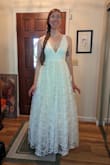 OK, despite this being "the one," I was not immediately blown away when I put it on. But it's grown on me, and it's going to be perfect for our mountain elopement (and reception a couple of days later)! The tulle is very poofy, but I think it dresses up the dress a bit; I initially worried that the dress looked too casual, but the full skirt helps elevate it. The waist is pretty tight but not unbearable. I also ordered a L, and the waist was too roomy. The V-neck comes down past where a regular bra sits, so I'm going to have to get some sticky pads. However, it didn't look bad without any bra; I just want to look more supported. I haven't bought shoes yet, but I will definitely need some high high heels if I want to skip getting the dress hemmed. TBD... I can imagine wearing this dress again with some alterations: taking out a layer of tulle and hemming it above the knee. Just a thought! - Rebecca P.