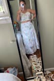 A little bit loose, but that's probably because I'm in between a medium and a large. Super flattering and great quality. Not see-through at all. Can't wait to wear it! - Emma O.
