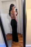This dress was beautiful! Very form-fitting but classy and sexy. It has a nice stretch and can easily be worn with or without a sticky bra. Wore it with 3-inch heels, and it was perfect. It also travels perfectly; we flew, and it had no wrinkles when we arrived and took it out of the garment bag. Compliments all night! - Chelsi C.