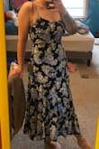 This was a little too boring for me, but it fit perfectly. The straps were very thin and dug into my shoulders, but it is a cute dress and you don't have to wear a bra with it. Has a straighter fit and is nice and light for a summer wedding. Being 5'4, it was a bit long if wearing sandals or flats, but with heels, it would be the perfect length. - Jamie F.