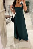 I wore this to a wedding and got so many compliments! I should've gotten it hemmed because it was a little long for me but I only tripped twice. The ties on the shoulders were so flattering but it was a little tight in the ribcage. Loved it! - Katlyn C.