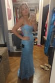 I wore this as a bridesmaid dress and got lots of compliments. I had to invest in alterations to get it to fit perfectly but it was worth it! The bust was a little loose fitting and I had it cinched at the back as well. I loved the embroidery detail! The photo was the fit before alterations for reference. - Meredith M.