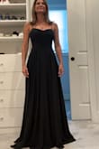 The dress is VERY VERY long even with heals. I wish you had petite sizes. I will see if I can get it tailored so the dress fits. My only concern is there's a slit of the side.  
If not, I will be returning the dress. In the photo, I have 4 inch heels on, but you can't tell. - Kimberly H.