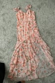I love that this dress has little sleeves, I prefer sleeves on dresses. I also love the color of this dress and the slit is just right with the ruffles. Modest but beautiful. Love this dress. - Andrea V.