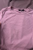 A perfect, simple, baby tee style crop top to go with high waisted shorts and skirts! Very soft. I got both colors. The purple is not as bright pink as it appears in their photos. It's a beautiful, muted color. - Ashley T.