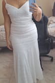 The material feels so soft and stretchy it's very flattering and comfortable. The tail is very long and it does get a little bit uncomfortable to walk on it (but that's just my preference, I will hem it). The back of the dress is very beautiful, if you don't have curves it might look a little bit odd on you so keep that in mind. - Ivanna P.