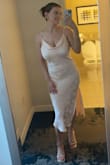 I thought this dress was very cute, it was perfect for the wedding I bought it for as the theme was summer/cocktail... but the dress is so see-through!!! I had to buy a shape wear bodysuit with shorts to wear under it so no one saw my goods. Another complaint is that the straps are so thin and as you tighten them you can see the material fray (zoom in on my shoulder). Since the material is sort of satin-like, it is also so wrinkly that I had to steam it several times before wearing. Overall, it's a very cute & classy dress but there are too many flaws for my liking :( - Katie H.