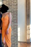 This dress arrive as pictured. I did have to tighten the straps so it wouldn't show as much cleavage. I also did sew the chest area so that it wasn't so low cut. I had read this in the reviews prior to purchasing. Overall, I'm happy with the purchase. - Kari G.