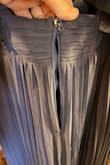 I tried the dress on today and went to take it off, and the zipper was stuck to the top. There was no budging of any kind with it. We tried for over half an hour. My husband had to break the zipper. :( I am so bummed I bought this in April and can't wear it or return it. Beautiful dress. Loved how it looked on. - Jennifer P.
