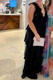 This gown was gorgeous! I knew it, and everyone else said so! It was very flattering and mega comfy for a very formal environment. The ruffled tiers start high instead of at the hip, which was lovely. I needed NO BRA and felt totally supported 100% of the time- no adjustments needed! I ordered the Large and XL but immediately returned the XL after only trying on the Large, as it was a perfect fit. The tie-back acted as an adjustment for sizing & support, as well as pretty detailing for the backside of the gown. - Ginger G.