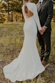 I ordered this dress to take wedding photos in Colorado (my husband and I had a quick courthouse marriage 5 years ago and I never got the dreamy wedding pics I wanted so badly) and it was perfect! I was hesitant at first but I didn't want to spend a fortune on a dress just for an hour of photos. I'm so glad I gave this dress a chance! It fit me perfectly, the material is thick and made really well. I had some trouble figuring out what to do about a bra. You can't do strapless due to the cut out back, so I tried nude nipple covers. The smaller ones outline showed through the material so I ordered Cakes brand covers and they worked great! If you're considering this dress, just order it and at least try it! It's so simple and classic but so beautiful in person. Highly recommend! - Caitlyn H.