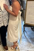 Loved this dress for my wedding rehearsal dinner. The only downside is that the bow is very heavy so the 4 small buttons on the back don't hold it there well. I ended up safety pinning it on because it would pop when I moved. - Abby C.