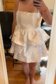 I liked this dress a lot it was just a little too poofy for my taste. It fit well and the material was sturdy. Definitely leave time to steam/iron this dress. It was really cute I just found something I liked better. - Brittany M.
