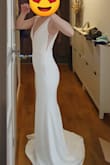 Unexpectedly, I found my wedding dress! I was looking for something simple and elegant, but wedding shops offer tons of laces with prices ranging from 800 to 4000 euros. I ordered here from sheer desperation. I was shocked it arrived in the Netherlands over the weekend (I paid for air delivery), and it fits perfectly. Material is stretchy. I still need to shorten the length, but that was expected (I'm only 160cm on heels). The only downside I'd like to note is that the textile, although heavy, is a bit transparent. You can see the seams well, and it gives a cheap feeling. It is also great for girls with small breasts. I'm size 75B. Yes, it could do with some inbuilt pudding but is also good to go without. A metal bone at the chest was off but my tailor put it right. He also needed to make a netting at the back tighter, because, as many mentioned here, it was sticking out (but not drastically). Anyhow, I'm satisfied, and thank you Lulus for your great customer support! - Irina B.