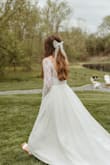 This bow completed my wedding day look. I was able to do my hair myself because the clip of this bow holds REALLY well. I did not need any additional ties or pins, and I have thick hair. - Carrie S.